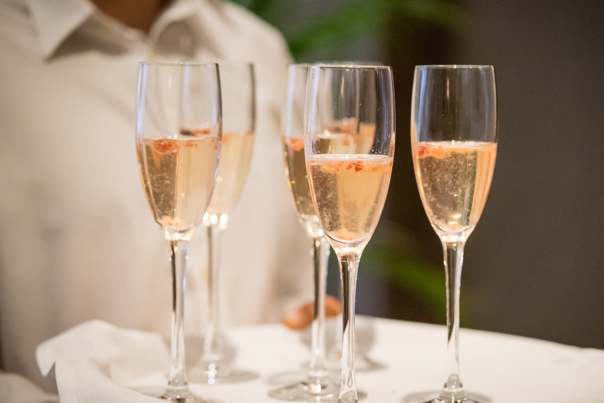 offering champagne for VIP esthetics treatment
